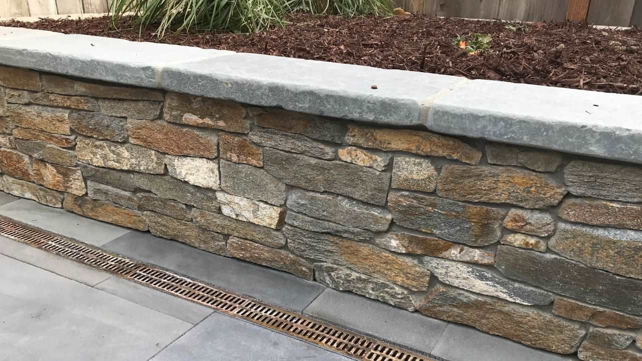 stone retaining wall bluestone caps